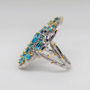 Aerie Swiss Blue Topaz Ring in Sterling Silver - Heron and Swan