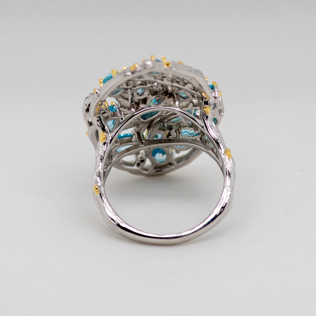 Aerie Swiss Blue Topaz Ring in Sterling Silver - Heron and Swan