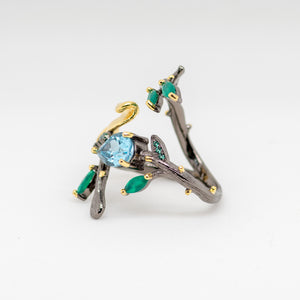 Monarch Sky Blue Topaz Ring in Sterling Silver - Heron and Swan